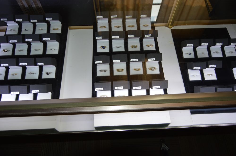 Extensive ring collection filling a large jewelry display case